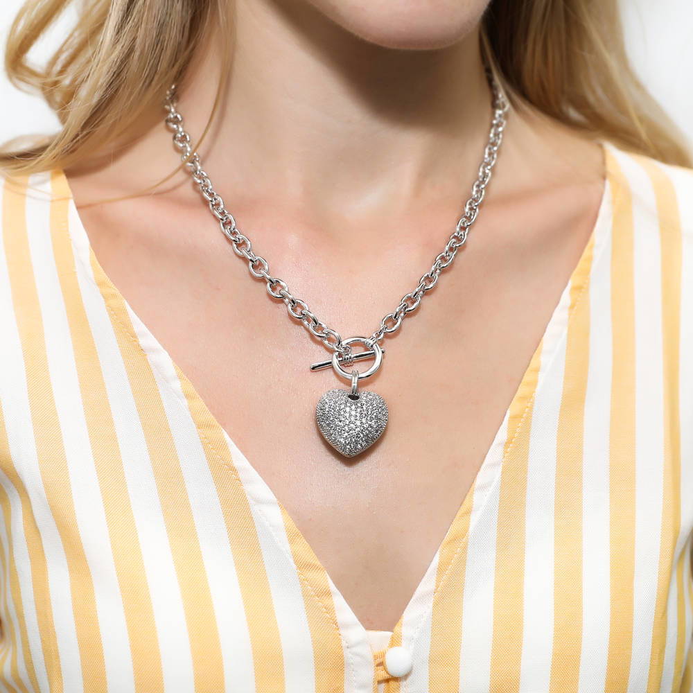 Model wearing Heart CZ Necklace Earrings and Bracelet Set in Silver-Tone