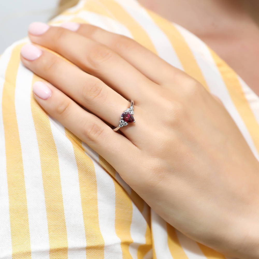 Model wearing Solitaire Red Pear CZ Ring in Sterling Silver 0.8ct