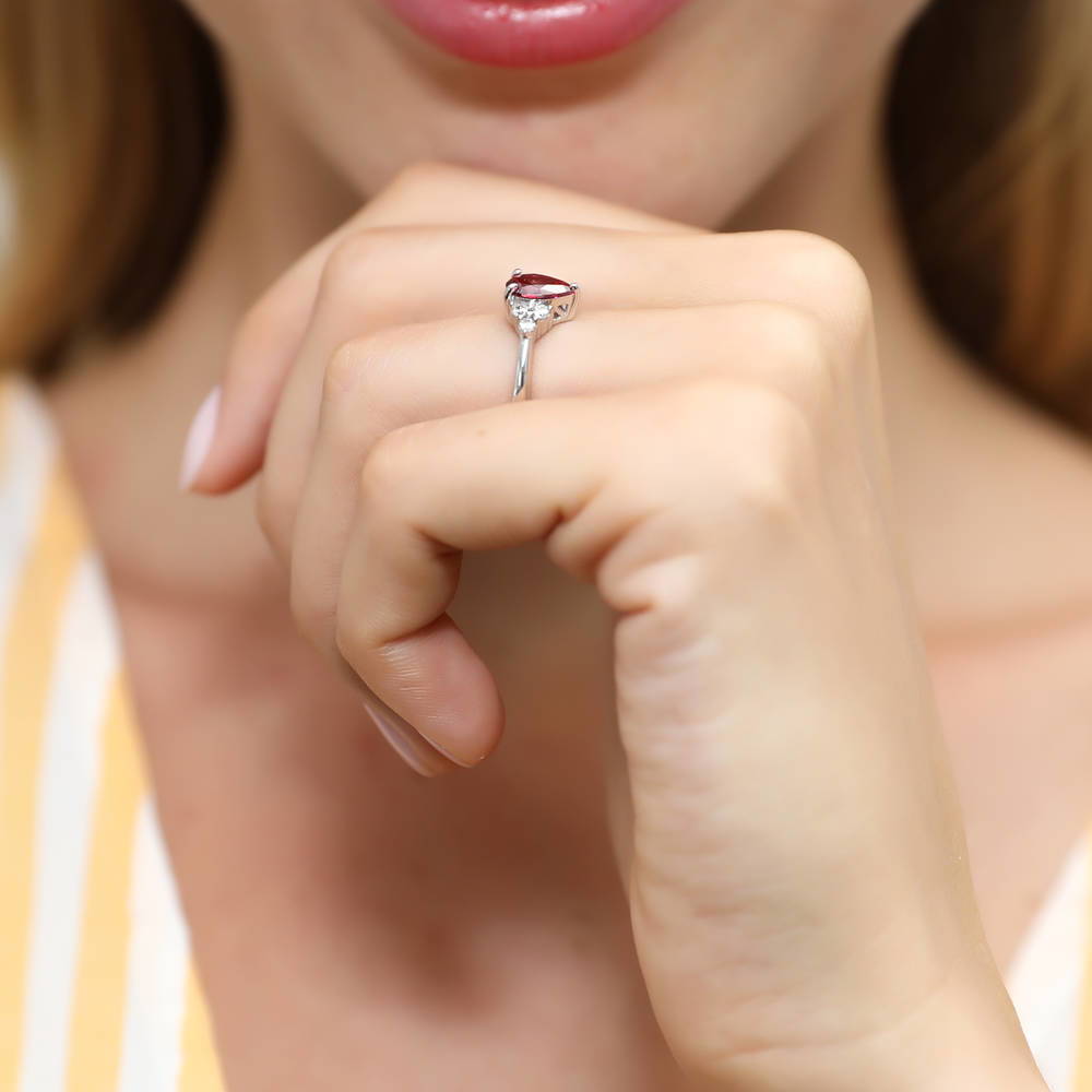 Model wearing Solitaire Red Pear CZ Ring in Sterling Silver 0.8ct