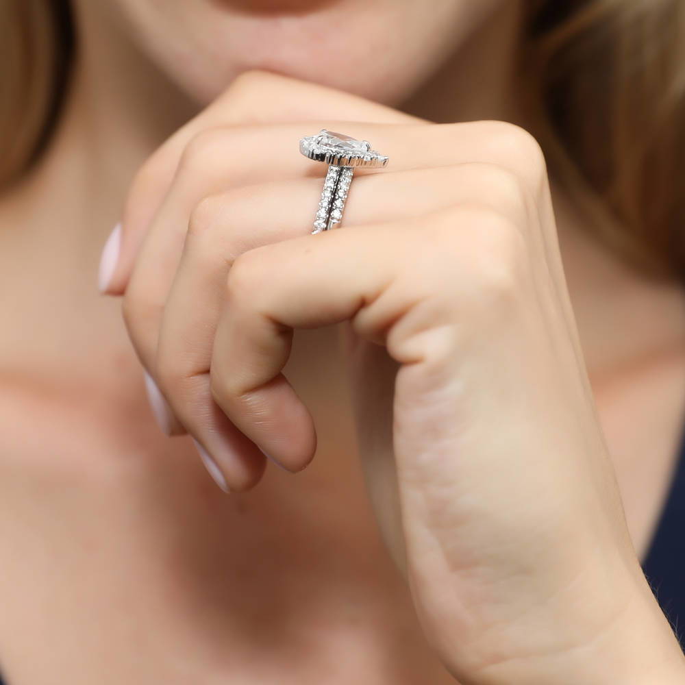 Model wearing Halo Pear CZ Ring Set in Sterling Silver