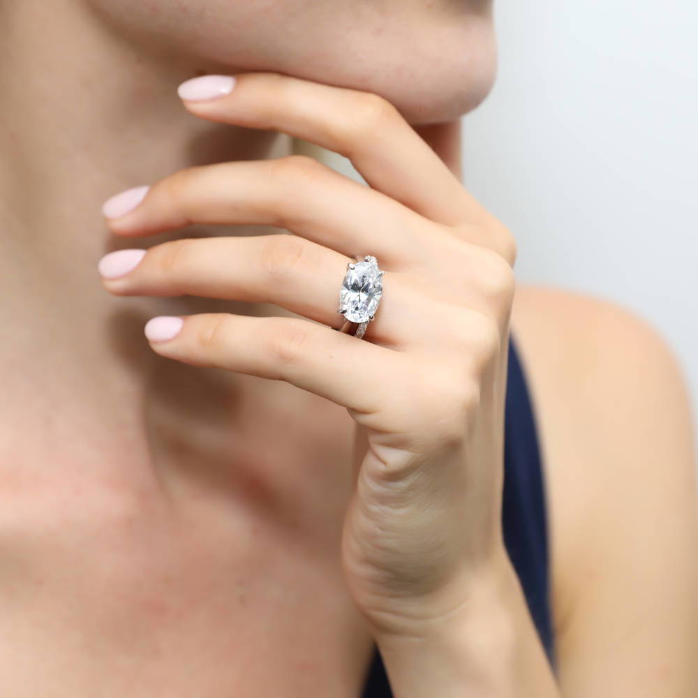 Model wearing East-West Solitaire CZ Ring Set in Sterling Silver