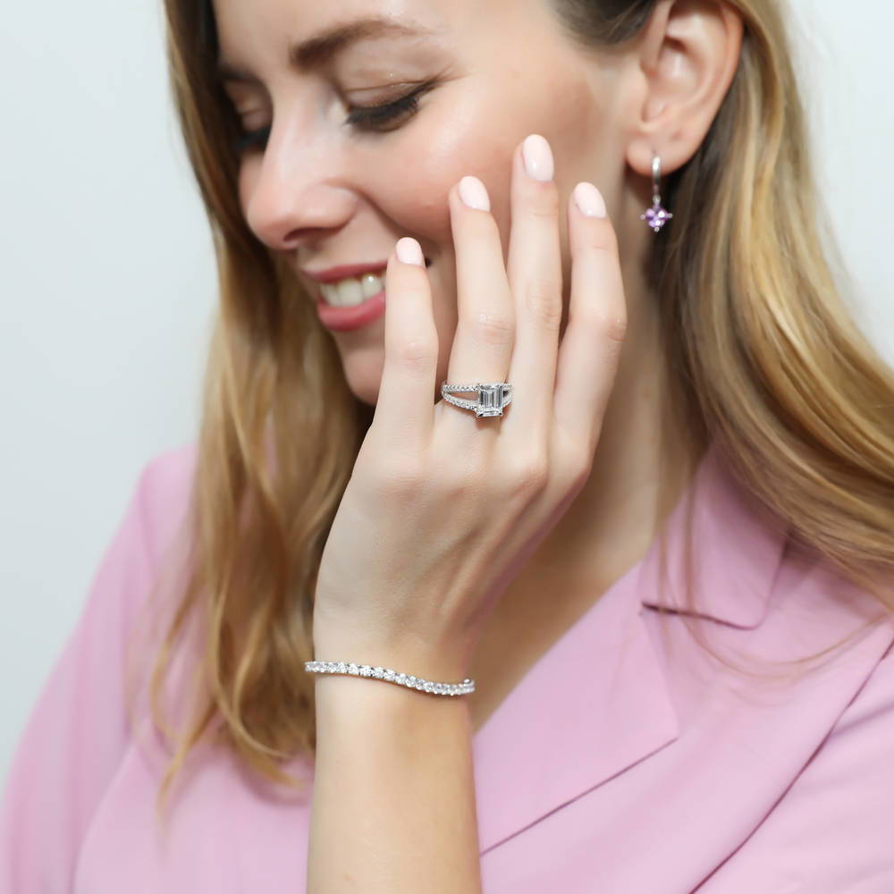 Model wearing Solitaire 2.6ct Emerald Cut CZ Split Shank Ring in Sterling Silver, 3 of 9