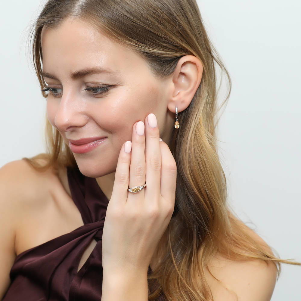 Model wearing 3-Stone East-West Yellow Oval CZ Ring in Sterling Silver, 7 of 9