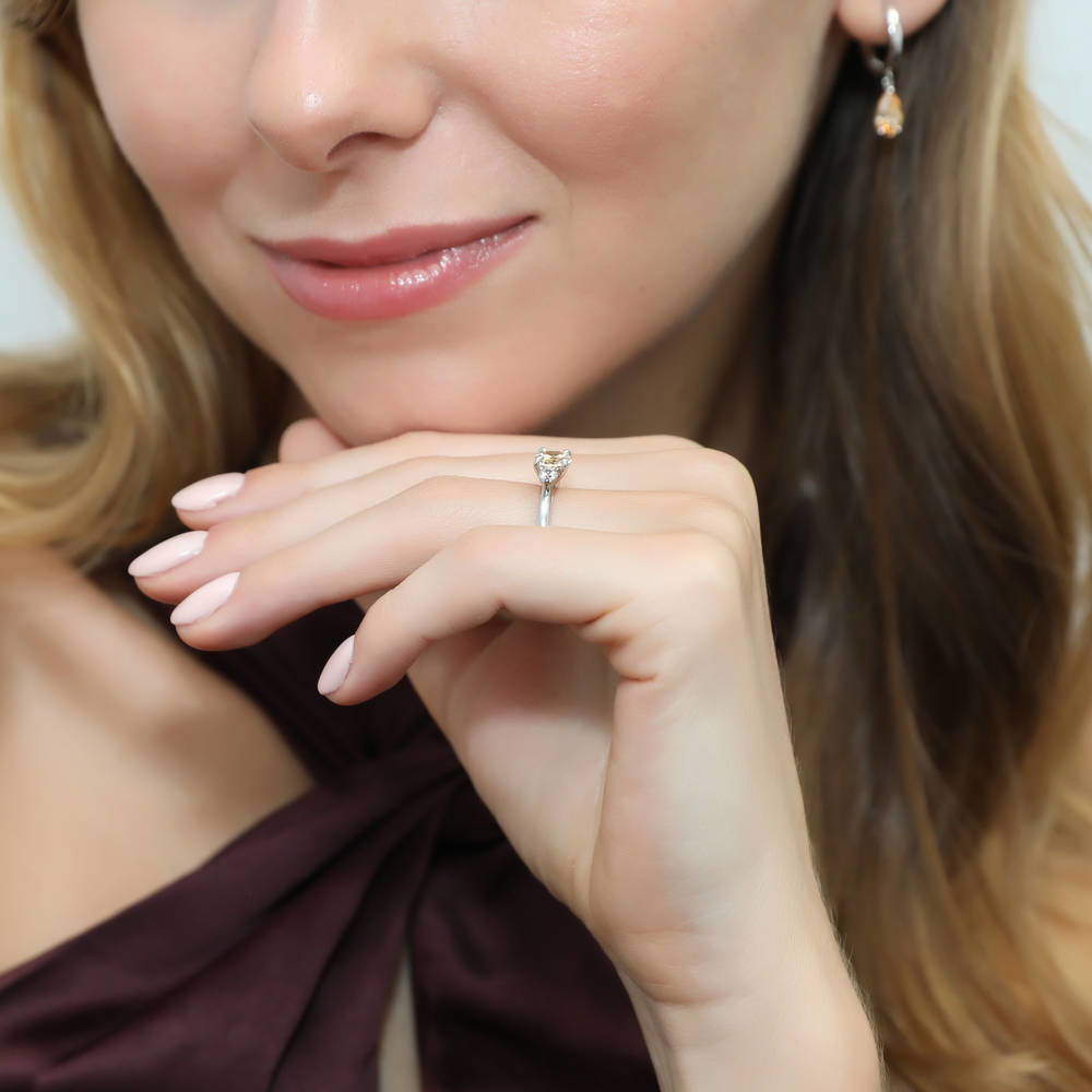 Model wearing 3-Stone East-West Yellow Oval CZ Ring in Sterling Silver, 6 of 9
