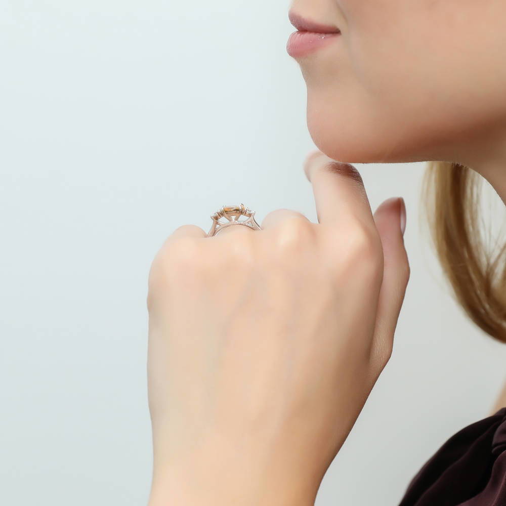 Model wearing 3-Stone East-West Yellow Oval CZ Ring in Sterling Silver, 3 of 9