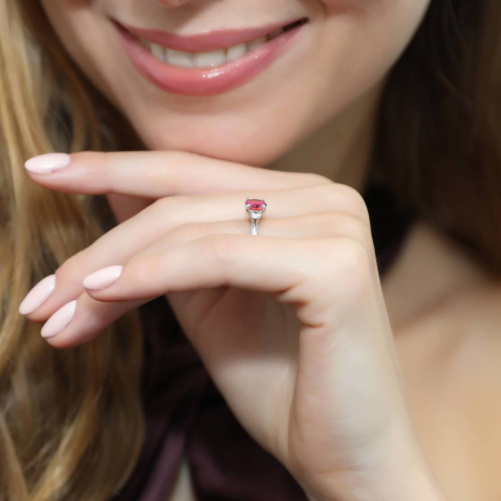 Model wearing 3-Stone East-West Red Oval CZ Ring in Sterling Silver, 6 of 8