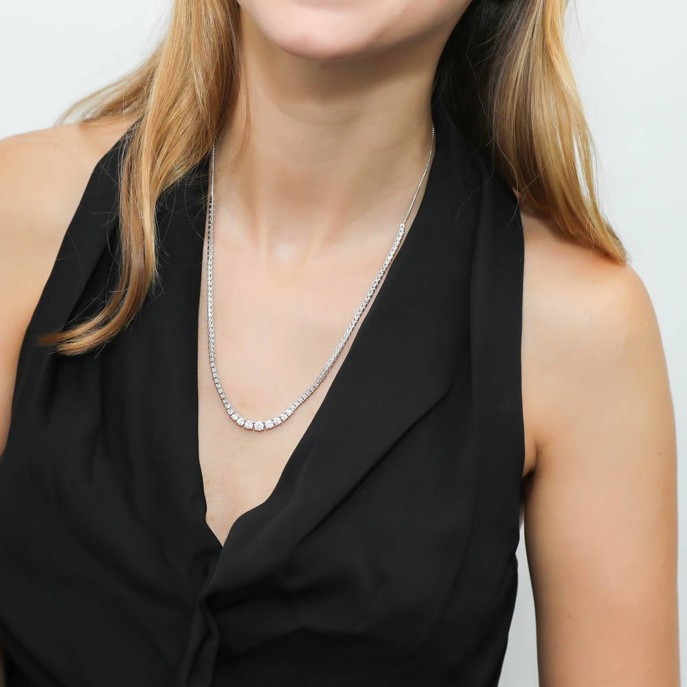 Model wearing Graduated CZ Pendant And Tennis Necklace Set in Sterling Silver