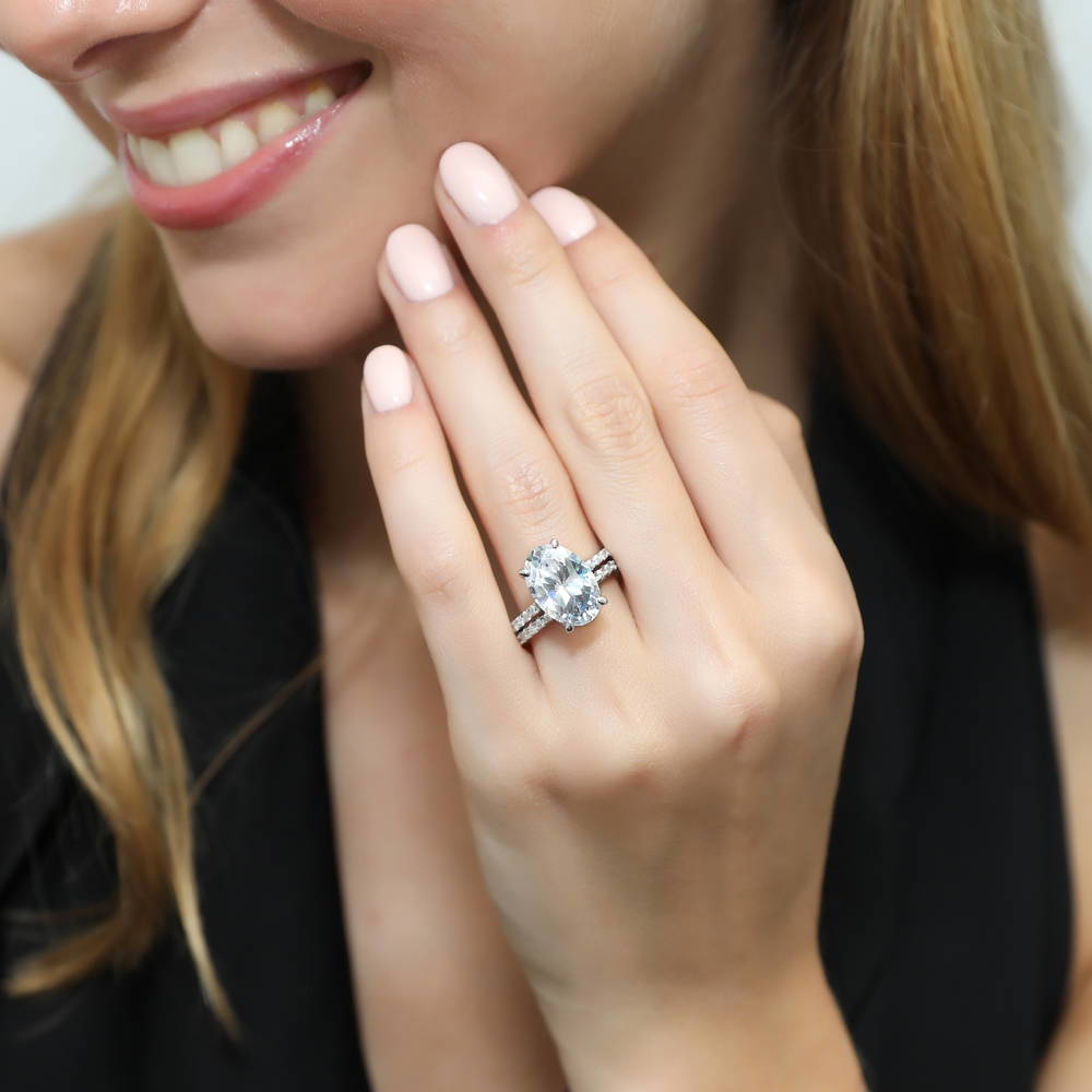 Model wearing Hidden Halo Solitaire CZ Ring Set in Sterling Silver