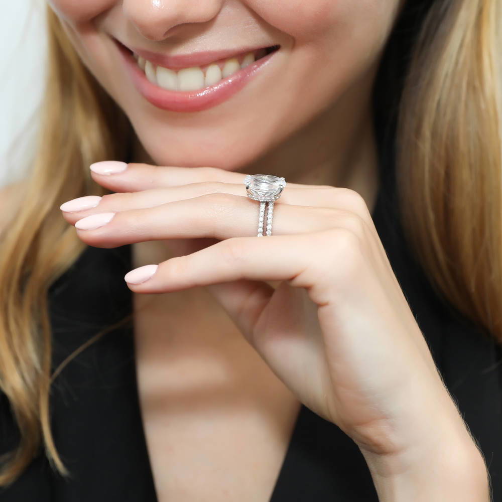 Model wearing Hidden Halo Solitaire CZ Ring Set in Sterling Silver