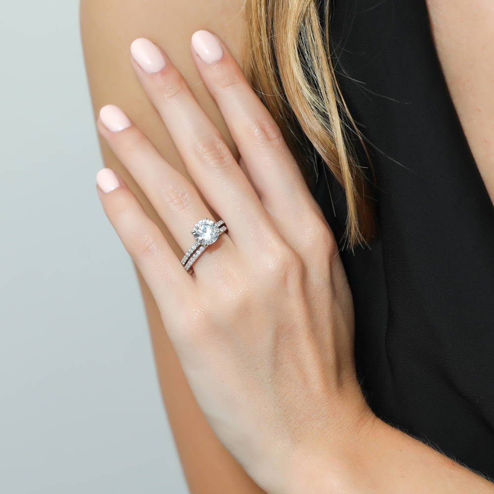 Model wearing Hidden Halo Solitaire CZ Ring Set in Sterling Silver