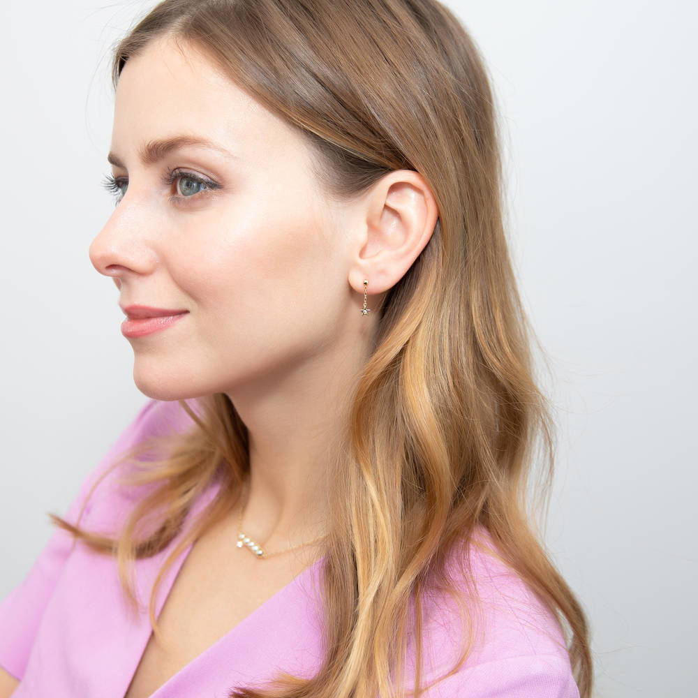 Model wearing Bar Star Imitation Pearl Dangle Earring in Gold Flashed Sterling Silver