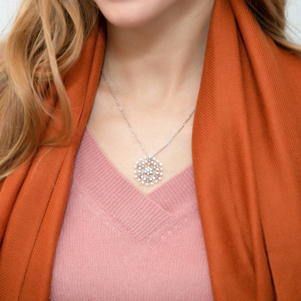 Model wearing Snowflake CZ Pendant Necklace in Sterling Silver