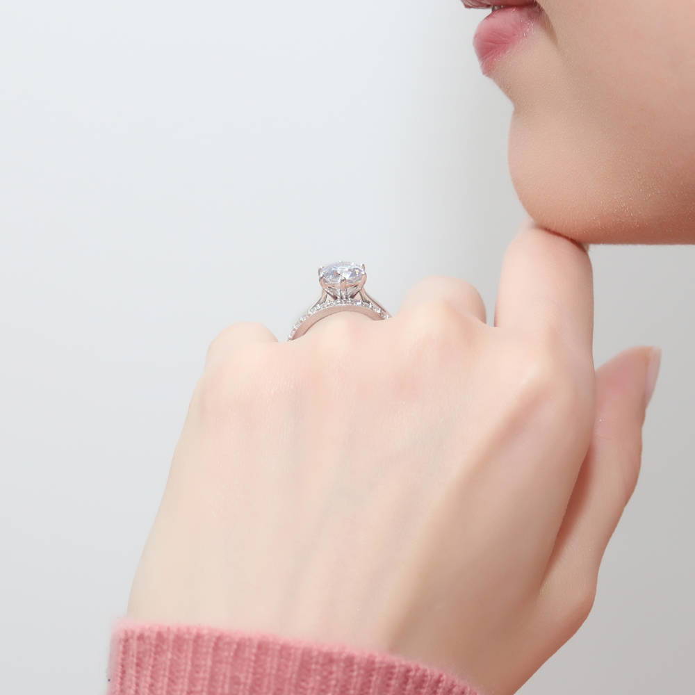 Model wearing Solitaire 2ct Round CZ Ring Set in Sterling Silver