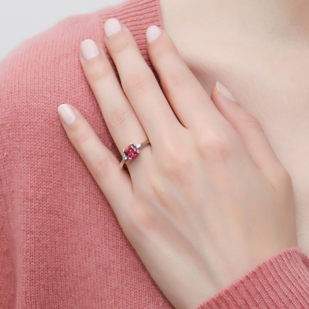 Model wearing 3-Stone Red Cushion CZ Ring in Sterling Silver