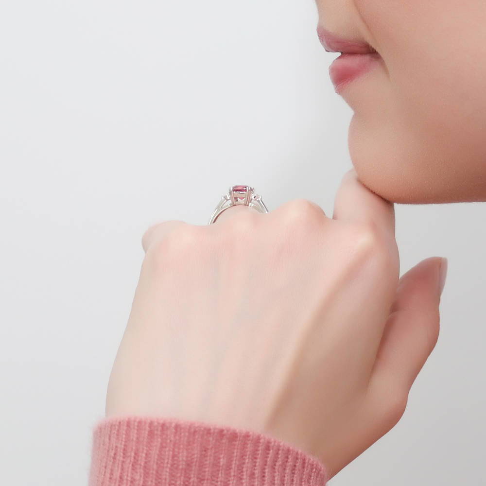 Model wearing 3-Stone Red Cushion CZ Ring in Sterling Silver