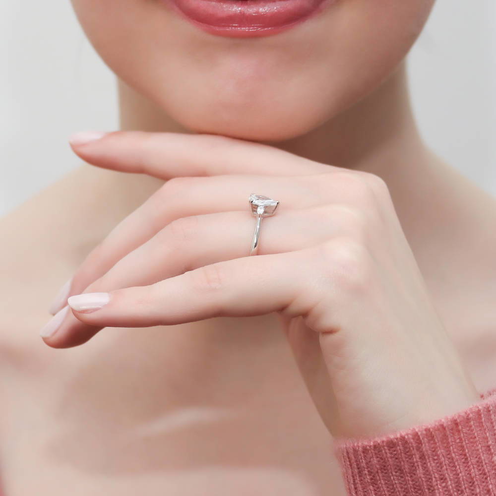 Model wearing 3-Stone Pear CZ Ring in Sterling Silver