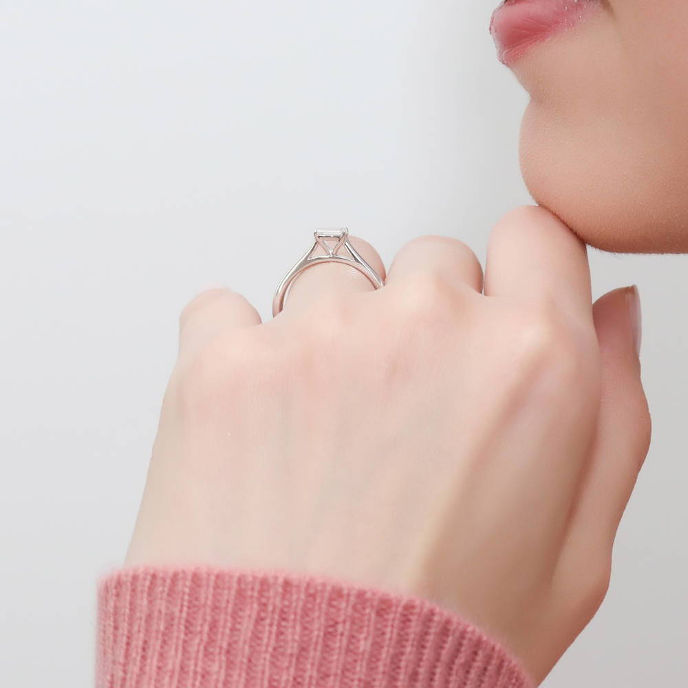 Model wearing Solitaire East-West 0.3ct Emerald Cut CZ Ring in Sterling Silver