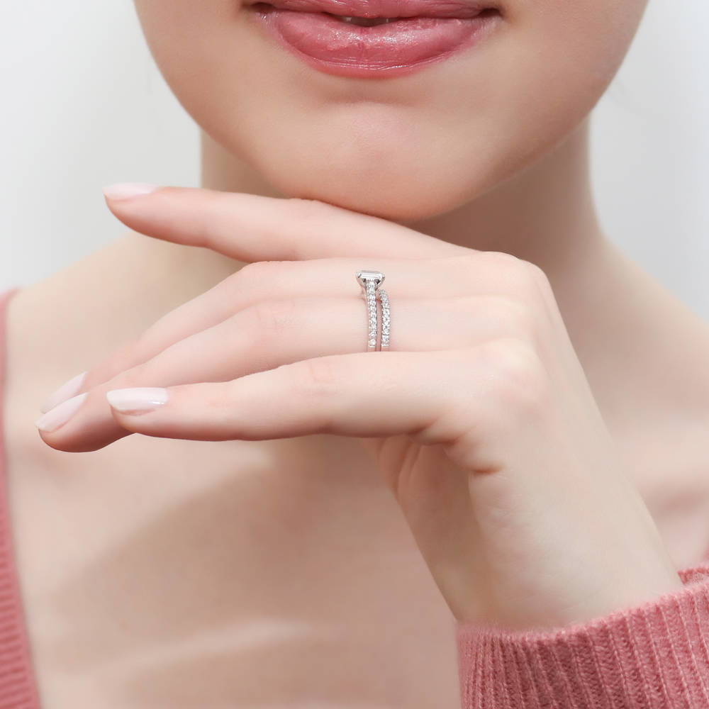 Model wearing Solitaire 0.3ct Emerald Cut CZ Ring Set in Sterling Silver