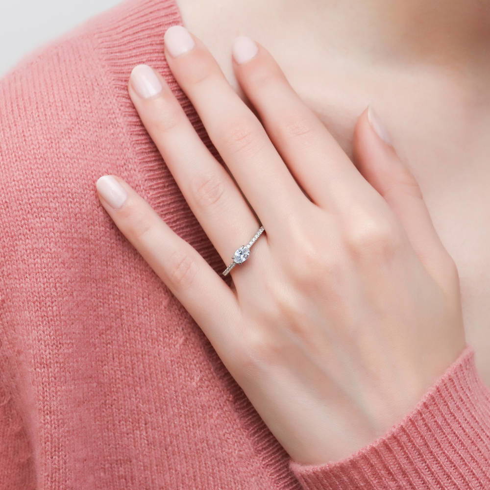 Model wearing Solitaire 0.4ct Oval CZ Ring in Sterling Silver, 2 of 9