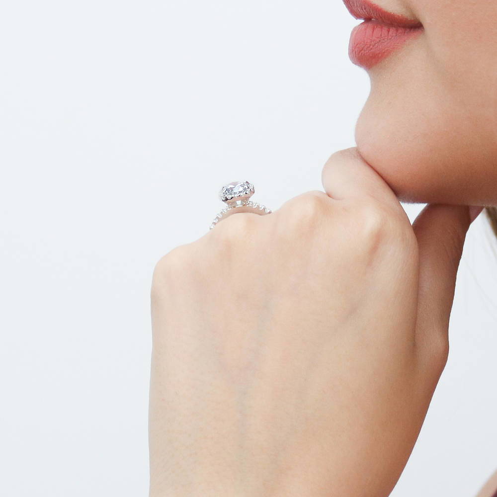 Model wearing Halo Round CZ Ring in Sterling Silver