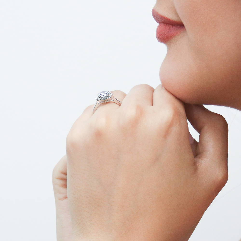 Model wearing Sunburst Halo CZ Ring in Sterling Silver