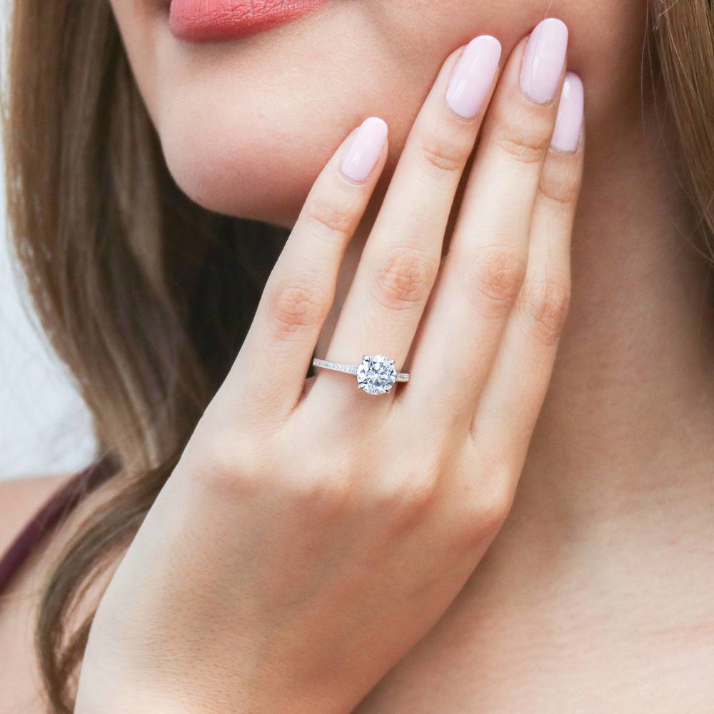 Model wearing Solitaire Milgrain 2ct Round CZ Ring in Sterling Silver