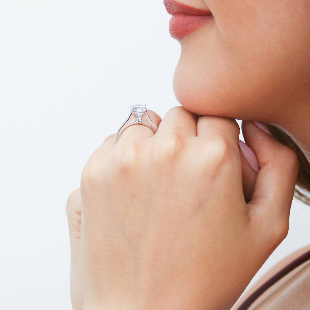 Model wearing Solitaire Milgrain 2ct Round CZ Ring in Sterling Silver