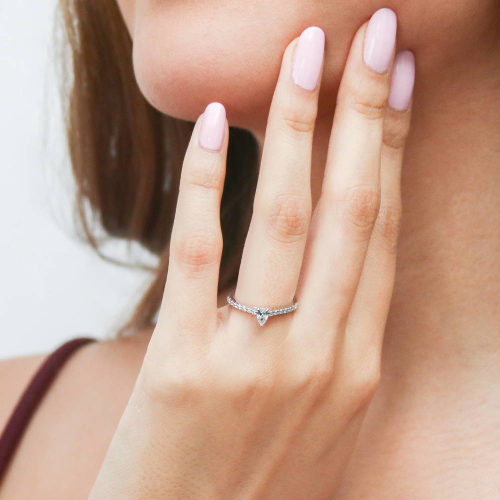 Model wearing Solitaire 0.3ct Pear CZ Ring Set in Sterling Silver