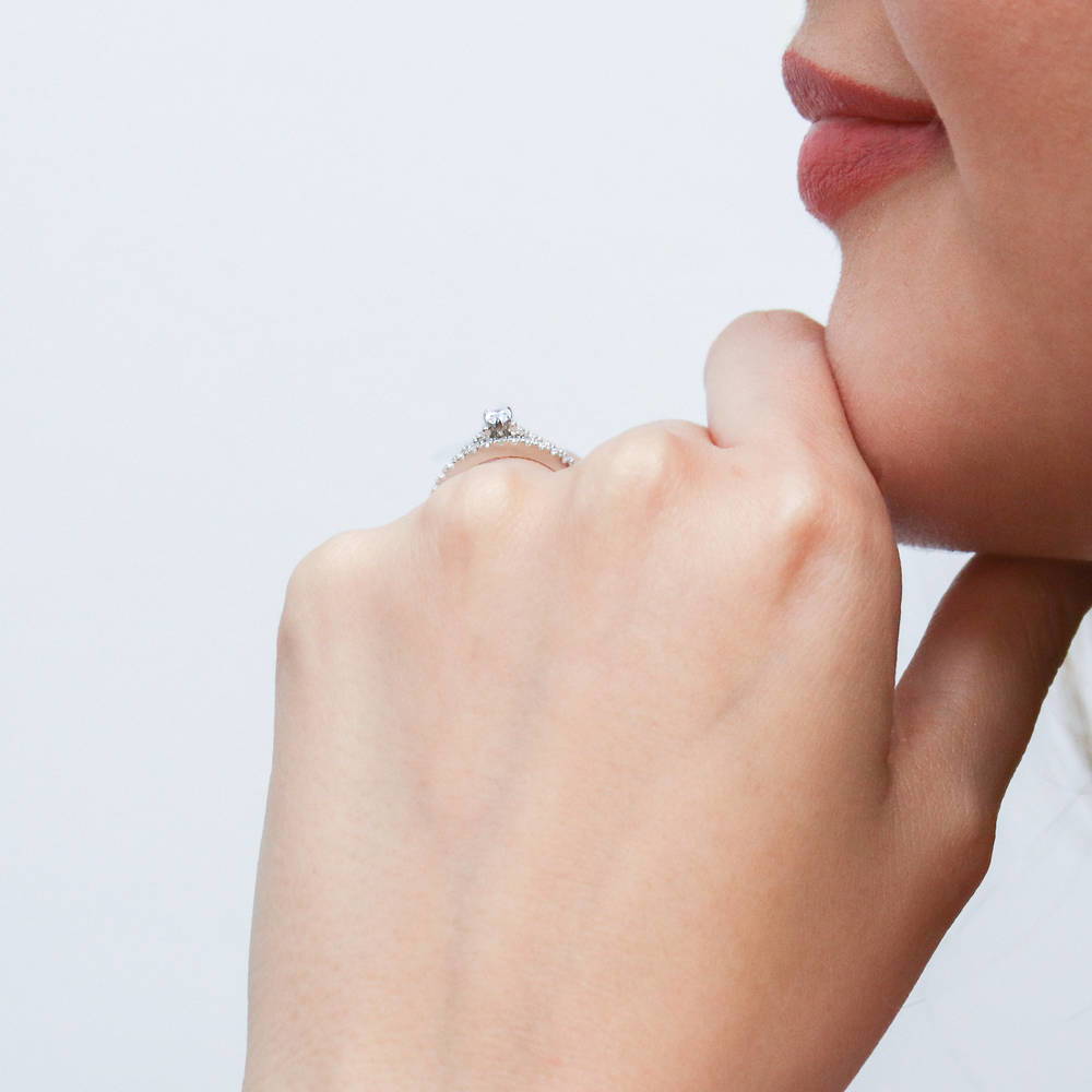 Model wearing Solitaire 0.3ct Pear CZ Ring Set in Sterling Silver