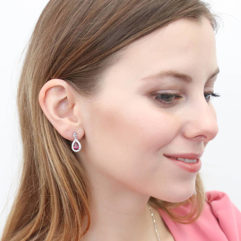 Model wearing Halo Pear CZ Dangle Earrings in Sterling Silver