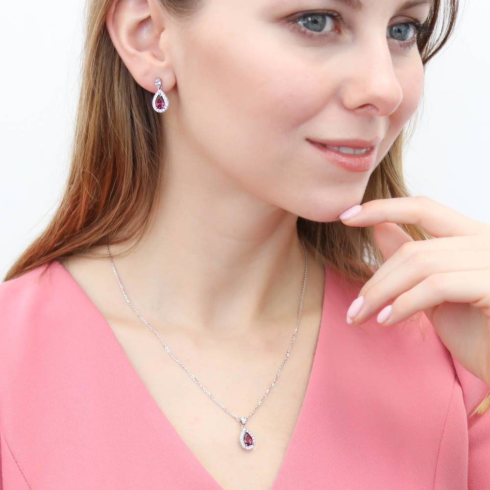Model wearing Halo Red Pear CZ Pendant Necklace in Sterling Silver