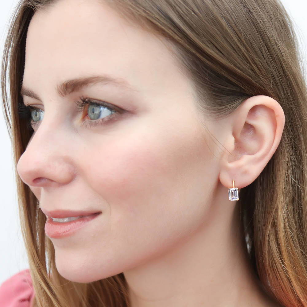 Model wearing Solitaire 4.8ct Emerald Cut CZ Earrings in Sterling Silver, 2 Pairs
