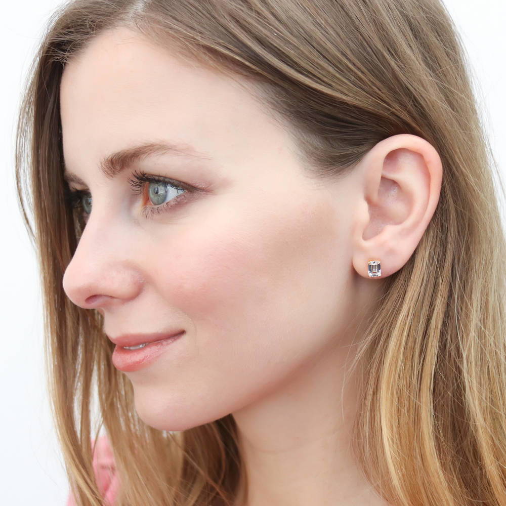 Model wearing Solitaire 2ct Emerald Cut CZ Stud Earrings in Sterling Silver