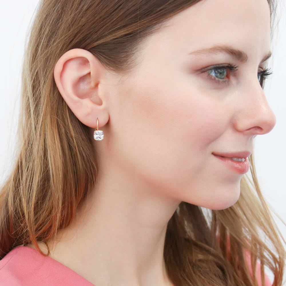 Model wearing Solitaire 4ct Cushion CZ Leverback Dangle Earrings in Sterling Silver