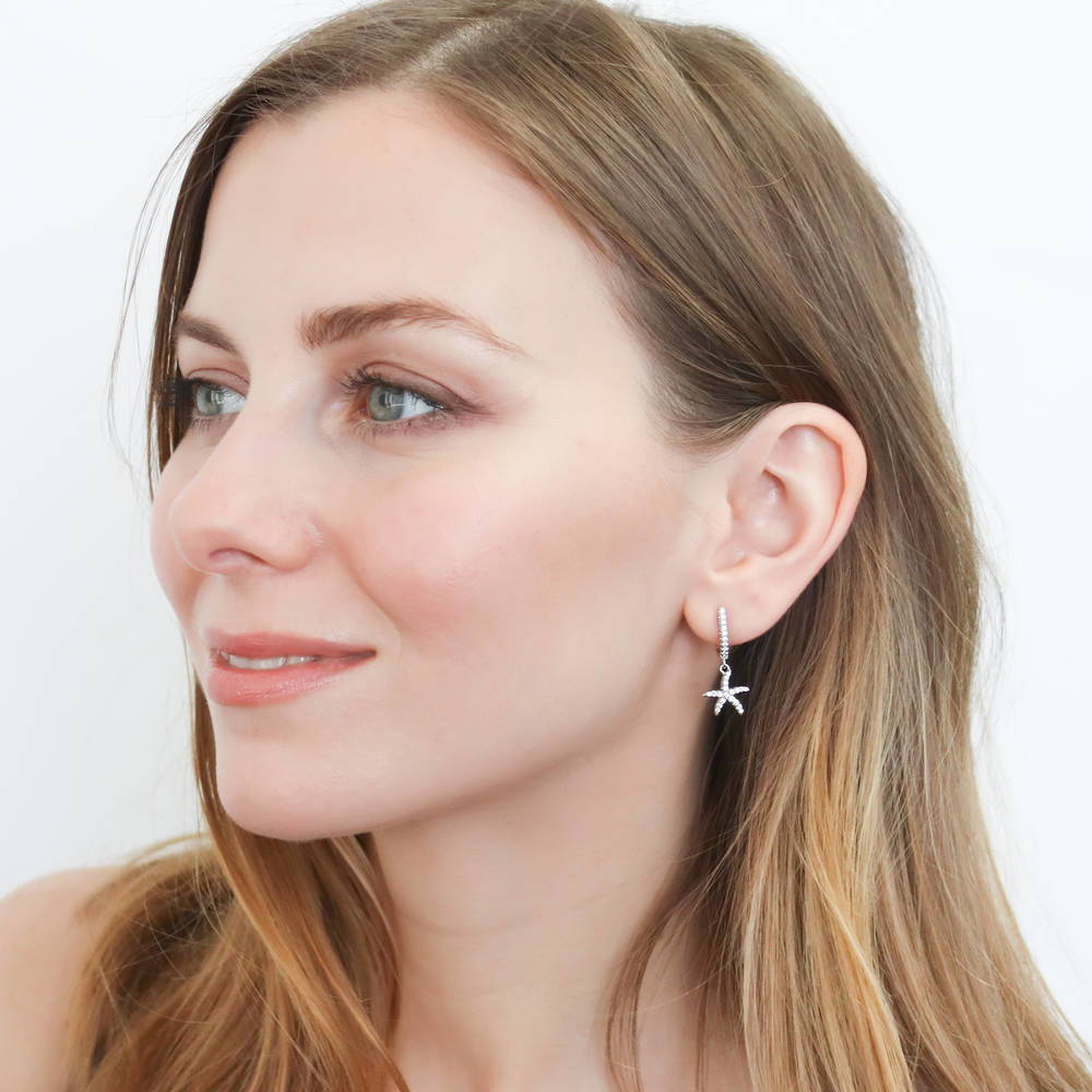 Model wearing Starfish CZ Dangle Earrings in Sterling Silver