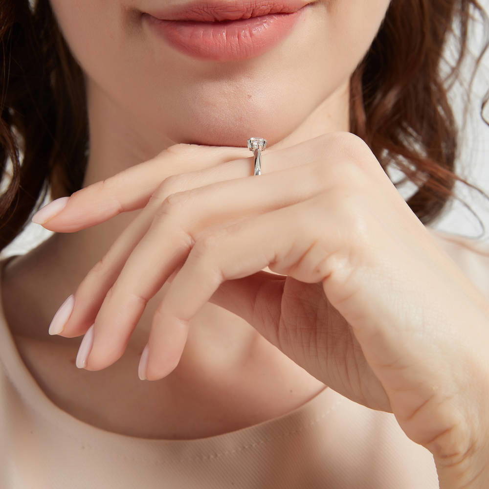 Model wearing 3-Stone Round CZ Ring in Sterling Silver