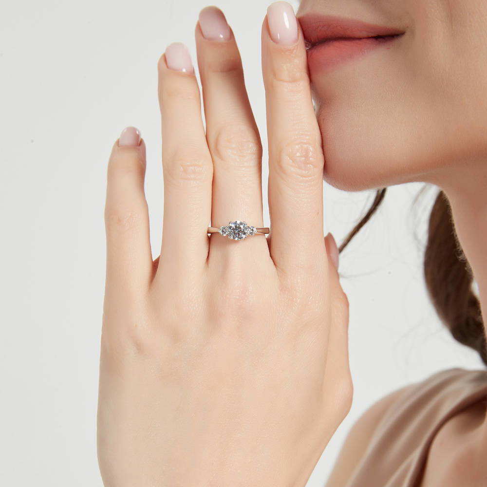 Model wearing 3-Stone Round CZ Ring in Sterling Silver