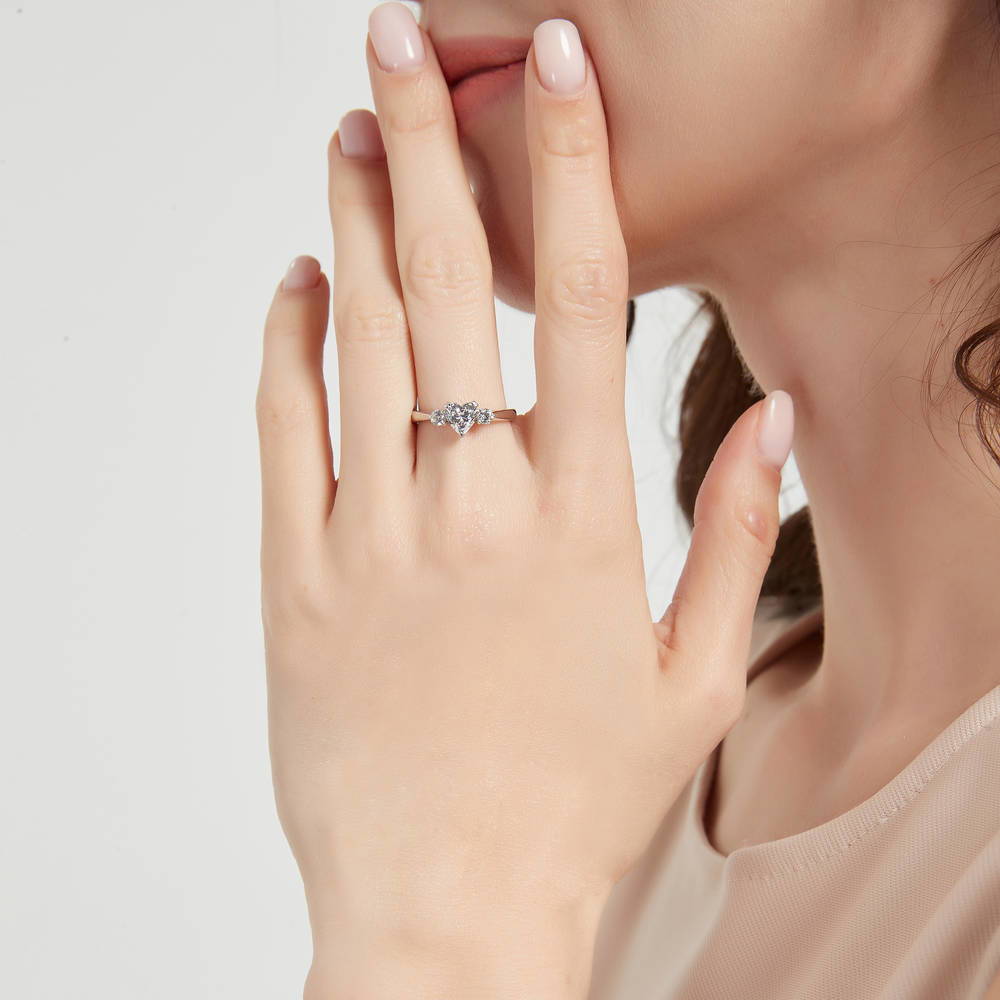 Model wearing 3-Stone Heart CZ Ring in Sterling Silver