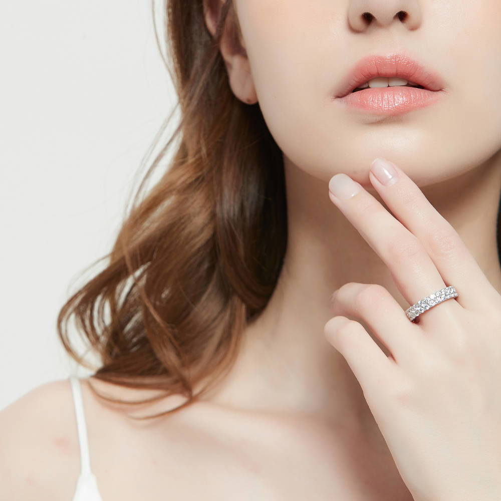 Model wearing Pave Set CZ Eternity Ring in Sterling Silver