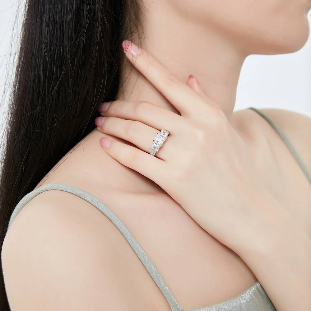 Model wearing 3-Stone Princess CZ Ring in Sterling Silver