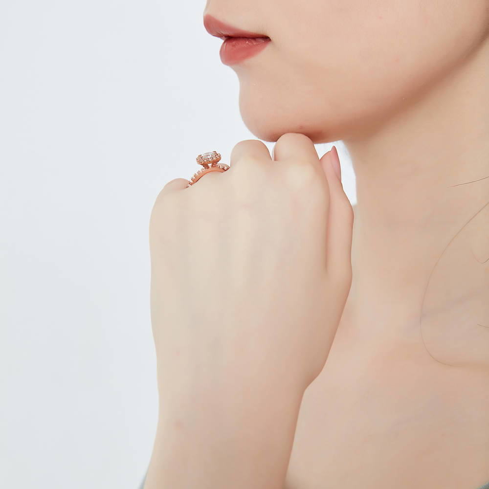 Model wearing Halo Round CZ Ring in Rose Gold Plated Sterling Silver