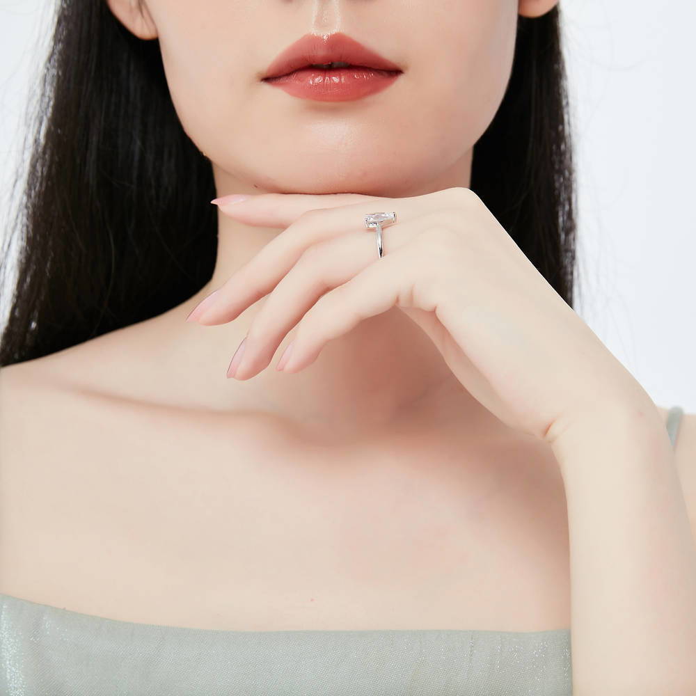 Model wearing Solitaire 1.8ct Pear CZ Ring Set in Sterling Silver, 8 of 15