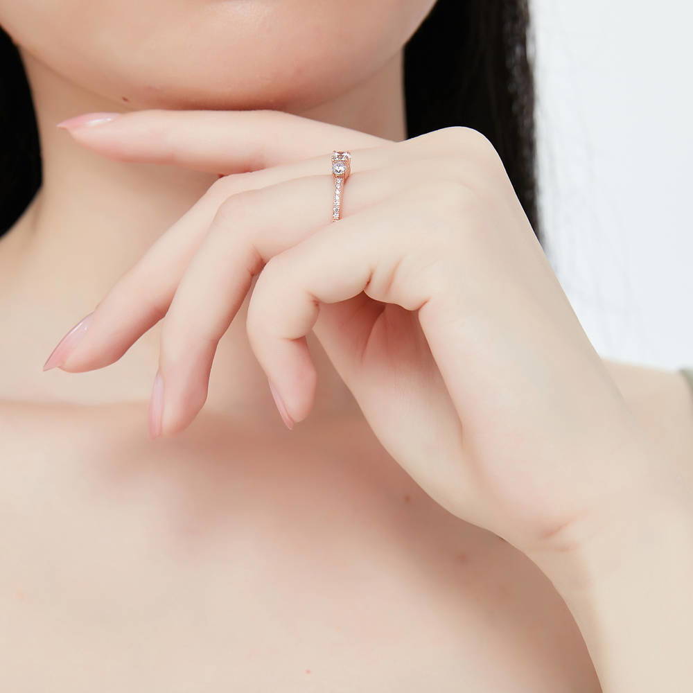 Model wearing 3-Stone Round CZ Ring in Rose Gold Plated Sterling Silver