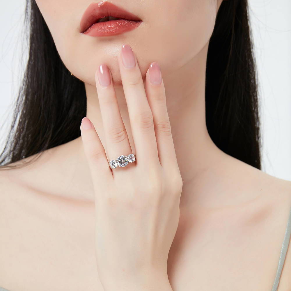 Model wearing 3-Stone Criss Cross Round CZ Ring Set in Sterling Silver