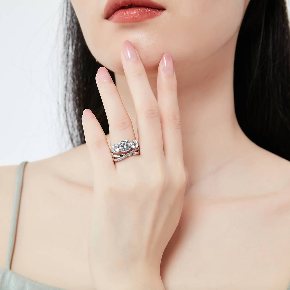 Model wearing 3-Stone Criss Cross Round CZ Ring Set in Sterling Silver