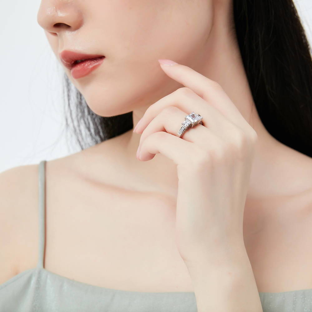 Model wearing 3-Stone Princess CZ Ring in Sterling Silver