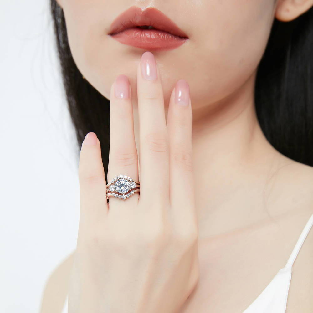 Model wearing 3-Stone 7-Stone Round CZ Ring Set in Sterling Silver