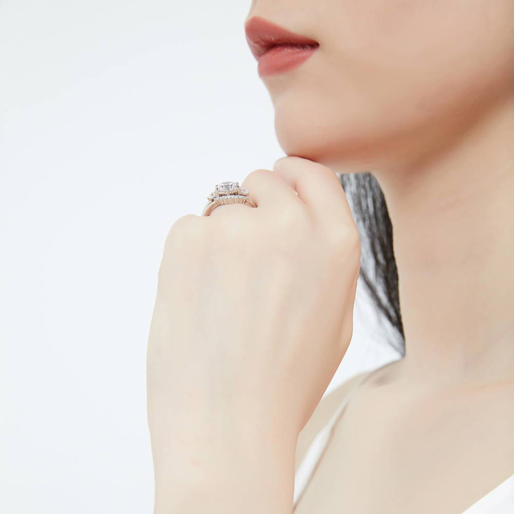 Model wearing 3-Stone 7-Stone Round CZ Ring Set in Sterling Silver