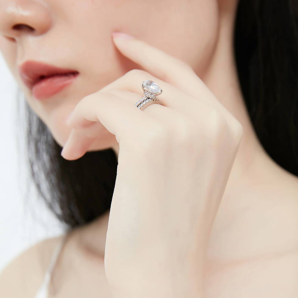 Model wearing Hidden Halo Solitaire CZ Ring Set in Sterling Silver