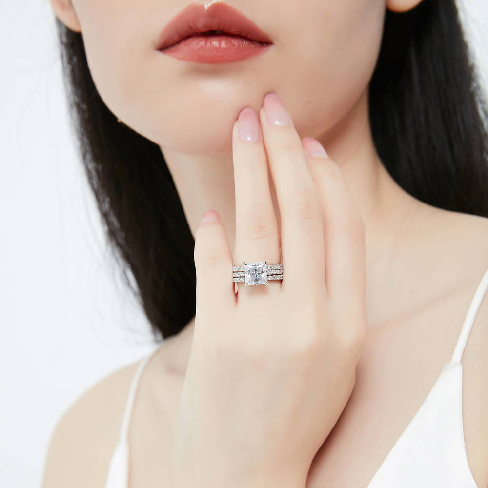 Model wearing Hidden Halo Solitaire CZ Ring Set in Sterling Silver